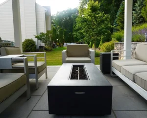 Gas fire feature on a backyard patio.