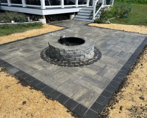 Circular firepit installed on a backyard patio for our New Jersey client.