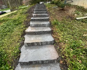 Close up of stone stairs alongside of a New Jersey home.